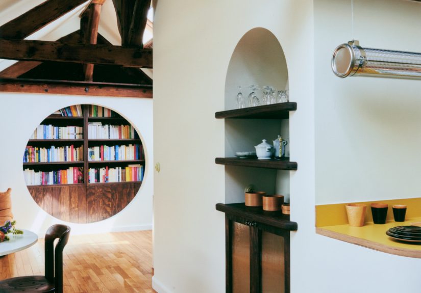 A Porthole Passage and a Moving Bookcase: An Apartment Remodel for a Writer in Paris